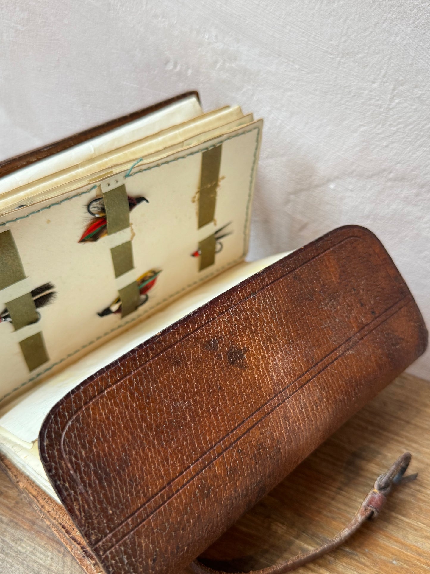 Antique leather fly fishing wallet